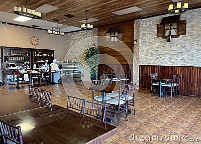 Interior of Noahs Ark Restaurant empty with owner wearing a face mask during COVID 2021 Fresno,Ca. Editorial Stock Photo