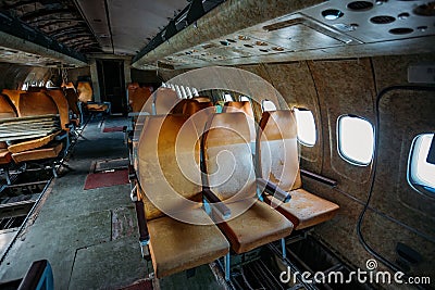 Inside of old abandoned passenger airplane. Plane wreck Stock Photo
