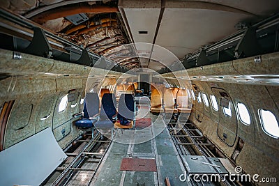 Inside of old abandoned passenger airplane. Plane wreck Stock Photo