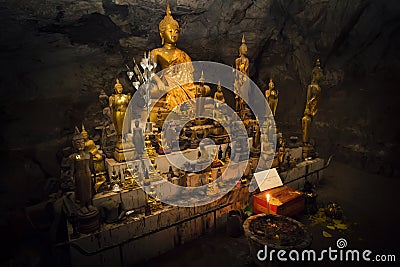 Inside Pak U cave are many gold-plated buddha-figures. cave is situated near Luang Prabang, Laos Stock Photo