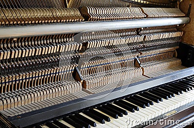 Inside the piano: string, pins and hammers Stock Photo