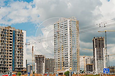 Inside place for many tall buildings under construction and cranes under a blue sky Editorial Stock Photo
