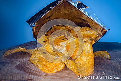 Inside the potato chips bag. Opened pack of original taste delicious potato crisps. Fast food and unhealthy eating concept Stock Photo