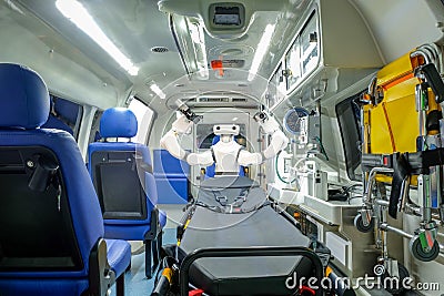 Inside smart ambulance car with medical equipment and smart robot assistant Stock Photo