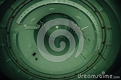 Inside unfinished reactor vessel of abandoned nuclear power plant. Bottom view of metal dome Stock Photo