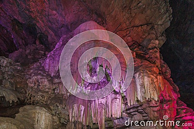 Inside view of borra cave with colorful lights, Araku Valley, Visakhapatnam Andhra Pradesh, India, March 04 2017 Editorial Stock Photo
