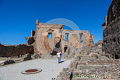 Inside view at the fortress ruins at the castle on medieval village of Figueira de Castelo Rodrigo, tourists visiting the monument Editorial Stock Photo