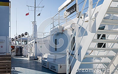 Inside view of Gozo Ferry Gaudos with equipment, flags, tower, seats, items and stairs. Malta Editorial Stock Photo