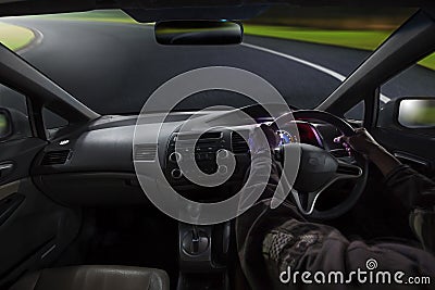 Inside view of man driving passenger car on sharp curve mountain Stock Photo