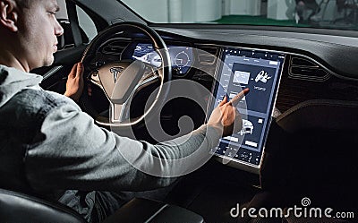 Inside view of Tesla Electric Vehicle. Sreering Wheel and Displays Editorial Stock Photo