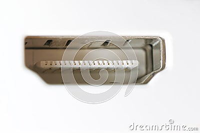 The insides of a hdmi connector on a white gadget. Reception of a video signal according to the hdmi standard. Modern technologies Stock Photo