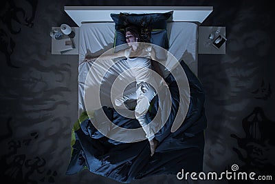 Insomnia and nightmare in bed at night Stock Photo