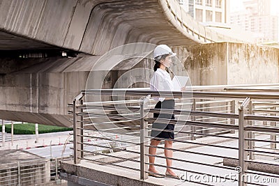 Inspection engineer asian woman working at construction site outdoor Stock Photo
