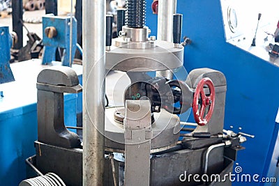 Inspection of pipeline valves, valves on a large metal automatic press in the production plant. Concept industry, work at the plan Stock Photo