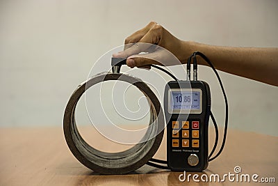 Inspection wall thickness pipe by ultrasonic thickness test for Stock Photo