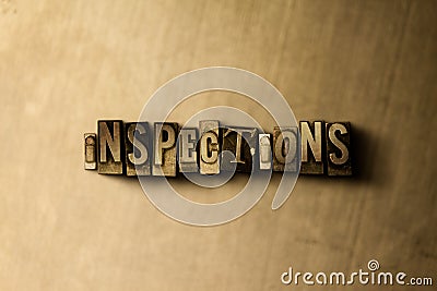INSPECTIONS - close-up of grungy vintage typeset word on metal backdrop Cartoon Illustration