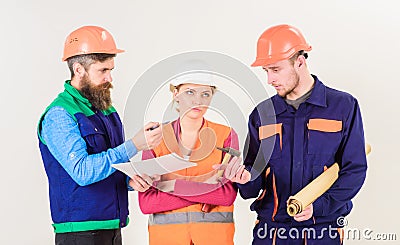 Inspector chastises employee, builder. Men and woman Stock Photo