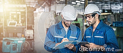 Two male industrial workers discussing. Stock Photo