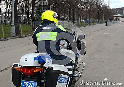 The inspector of the road police patrol on the service motorcycle controls the road. Editorial Stock Photo