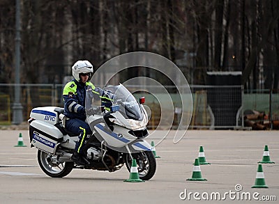 Inspectors of traffic police conduct training on extreme driving on official police motorcycles. Editorial Stock Photo