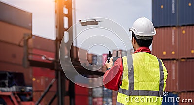 Inspectors use drones to check the security inside the container yard Stock Photo