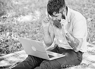 Inspiration for blogging. Looking for inspiration. Man bearded with laptop sit meadow nature background. Blogger Stock Photo