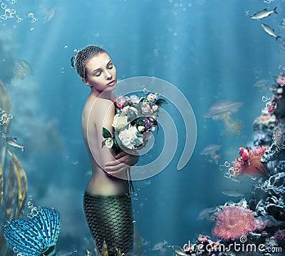 Inspiration. Fantastic Woman with Flowers in Water Stock Photo