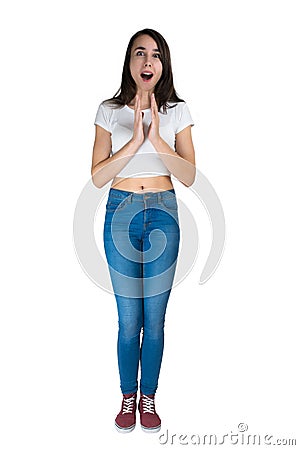 Inspiration. The girl with enthusiasm looks and puts her hands in front of her Stock Photo