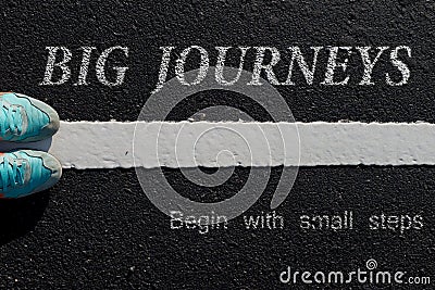 Inspiration quote : Big journeys begin with small steps on a Stock Photo