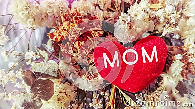 inspirational love concept - MOM text on heart shaped in vintage Stock Photo