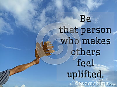 Inspirational motivational quote - Be the person who makes others feel uplifted. With man showing leaf in hand against blue sky Stock Photo