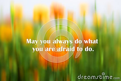 Inspirational motivational quote - May you always do what you are afraid to do. With abstract background of fresh blurry marigold Stock Photo