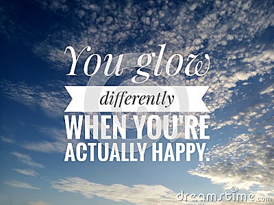 Inspirational motivational quote - You glow differently when you are actually happy. On background of bright blue sky and clouds Stock Photo