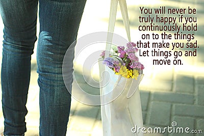 Let things go and move on. Concept photo with young woman legs wearing jeans carrying a white bag full of colored flowers Stock Photo