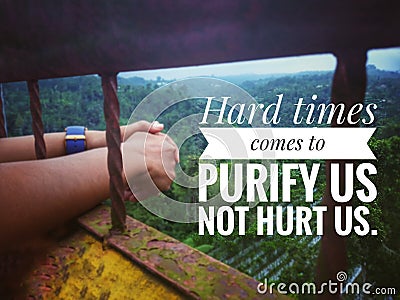 Inspirational quote - Hard times comes to purify us not hurt us. With blurry background of imprisoned hands and fresh green nature Stock Photo