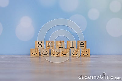 Inspirational quote - Smile. With happy face emotion graphic arranged in stair shape. Positive attitude, customer satisfaction, Stock Photo