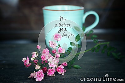 Inspirational words - Be a better you, for you. Self care and love motivational quote written on a coffee cup with pink roses plan Stock Photo