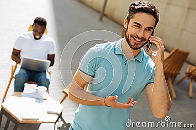 Inspired ambitious man asking his friend for something Stock Photo