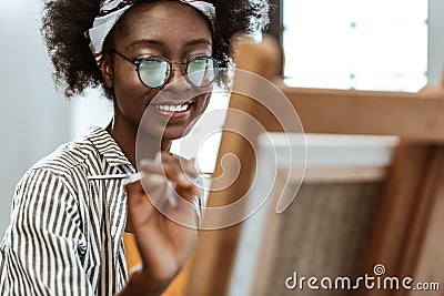 African-American artist smiling while feeling inspired and excited Stock Photo