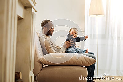 Inspired father amusing his son Stock Photo