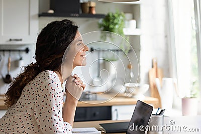 Inspired female take break in work dream distracted from laptop Stock Photo