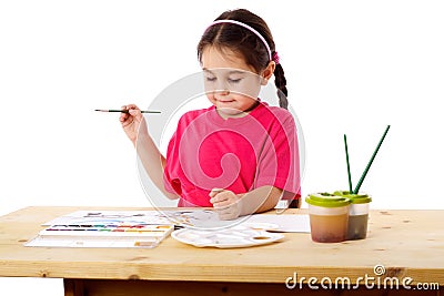 Inspired little girl who draws Stock Photo