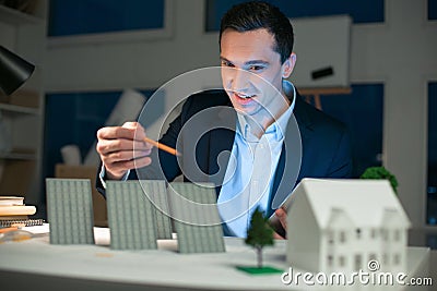 Inspired male engineer creating model Stock Photo