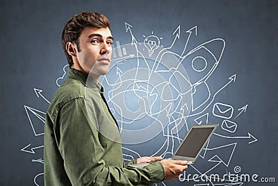 Inspired man with laptop, startup sketch Stock Photo