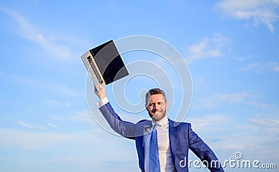 Inspiring innovations. Businessman inspired entrepreneur feels powerful going to change world. Man inspired holds laptop Stock Photo