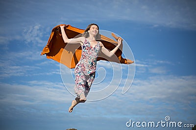 Young female flying sky summer suny day Stock Photo