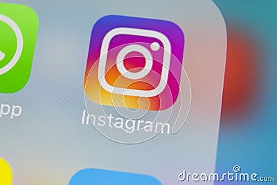 Instagram application icon on Apple iPhoneX smartphone screen close-up. Instagram app icon. Social media icon. Social network Editorial Stock Photo