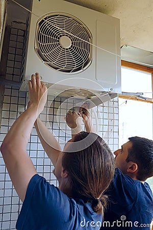 Install air conditioning Stock Photo