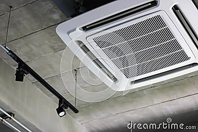 Install air conditioning on the ceiling in a restaurant Stock Photo