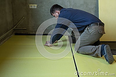 Installation of expanded polystyrene for floor insulation. Stock Photo